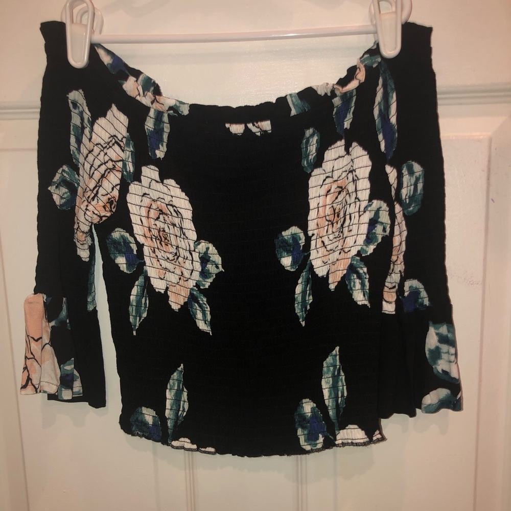A Smocked off the shoulder floral shirt